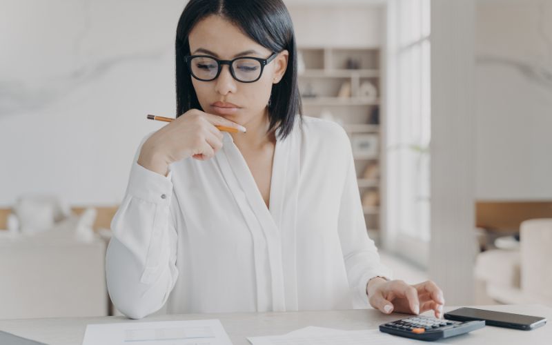 A accountant calculating the IC-DISC interest charge for tax savings.